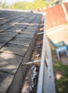 address ponding water on asphalt shingle roofs in Ohio low-slope designs