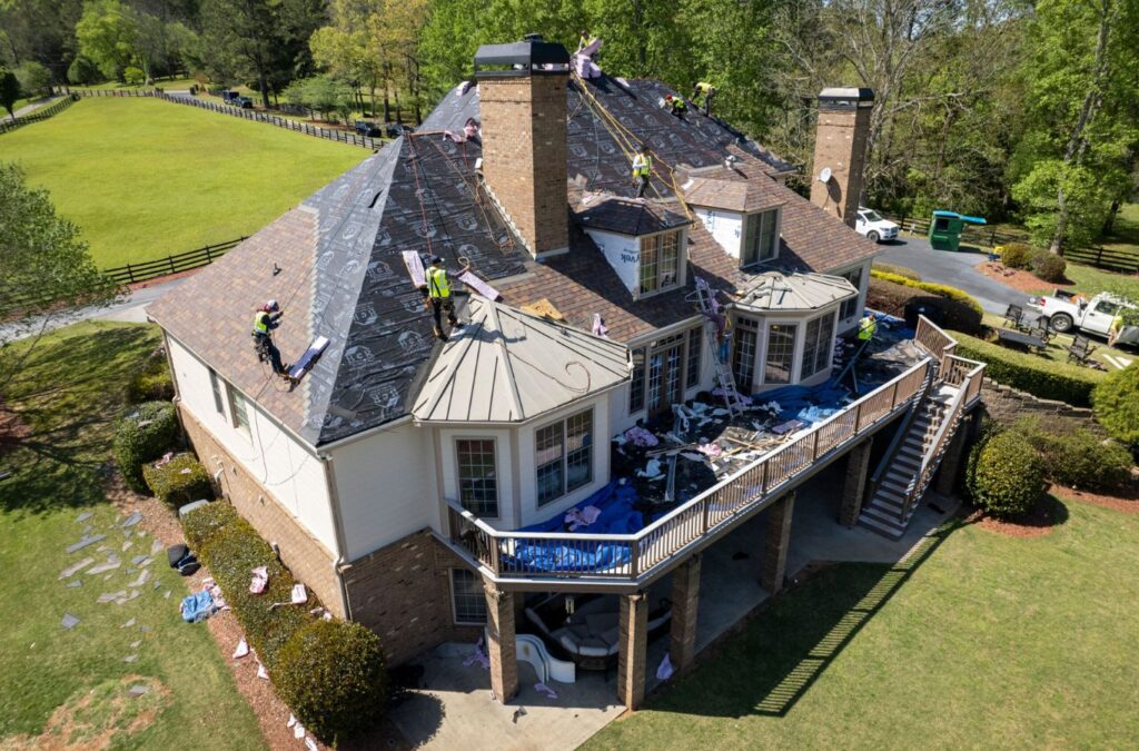 A Best Choice Roofing technician demonstrating the benefits of quality roof replacement for homes in Mount Clemens, MI.