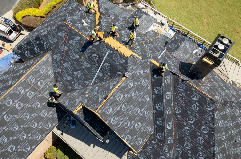 A Best Choice Roofing employee inspecting a roof, demonstrating why our services are the top choice. Roof replacement near me.