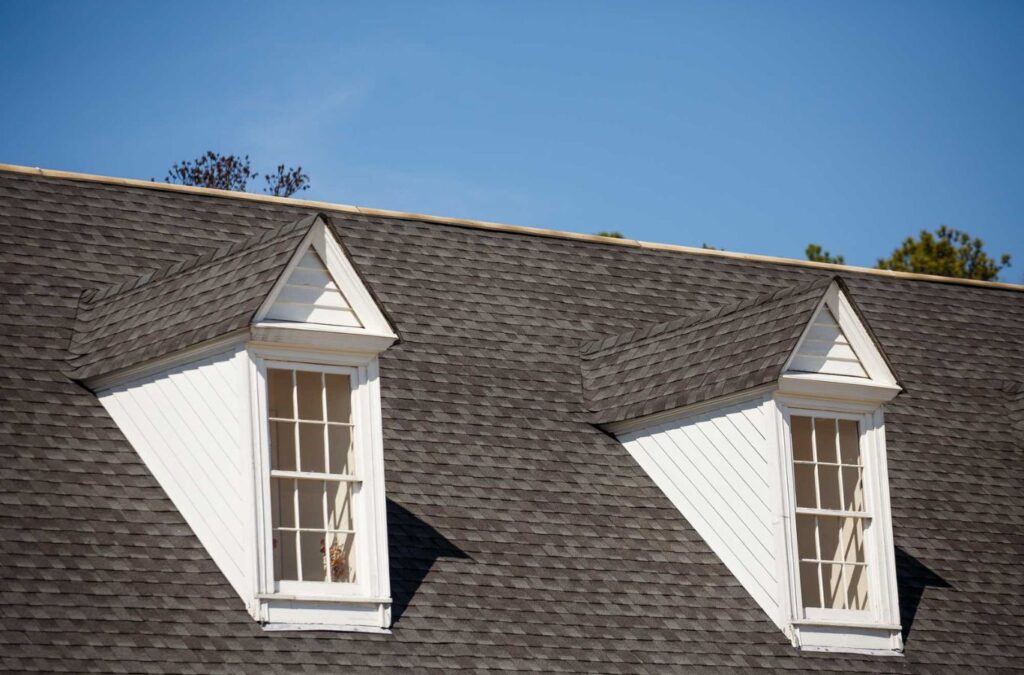 A roofing technician from Best Choice Roofing repairing a home’s roof in Redford Township, MI, highlighting the benefits of expert service.