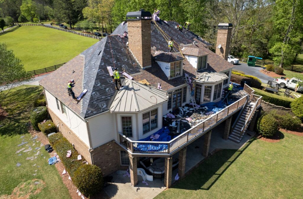 A Best Choice Roofing specialist performing roof installation in Troy, MI, demonstrating our dedication to quality and customer satisfaction. Roof Installation near me.