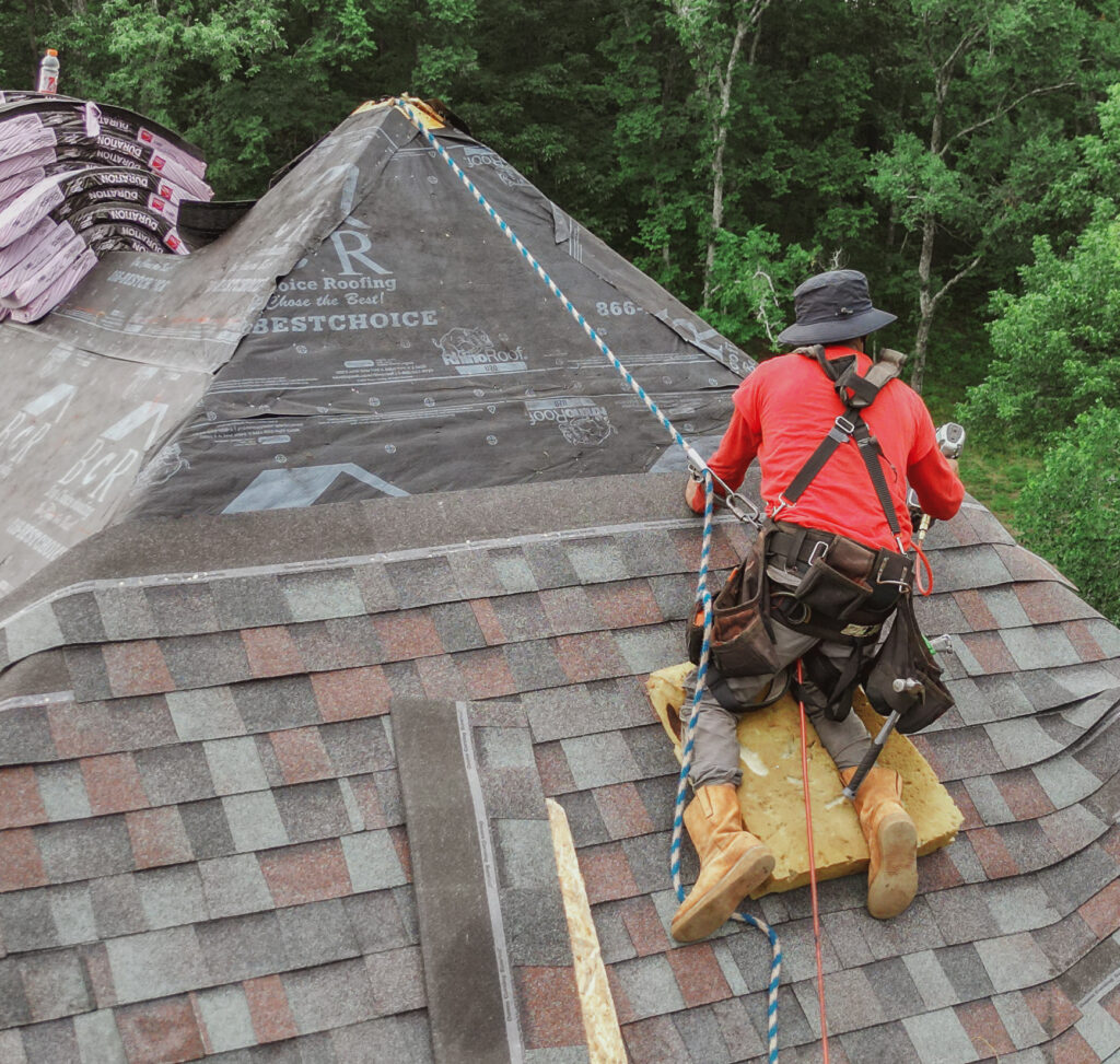 Roofing professionals working on a roof installation project
