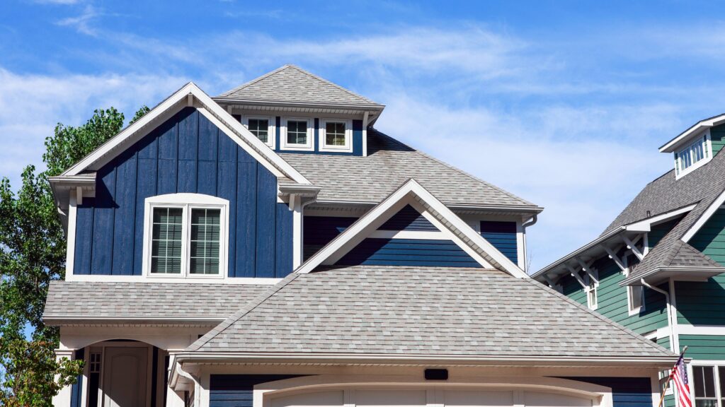 Expert asphalt shingle roofing team working on a residential roof in Twin Cities, MN near me.