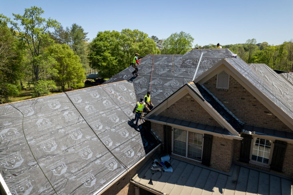 Roof installation in progress in Ramsey, MN, with a professional team at work.
